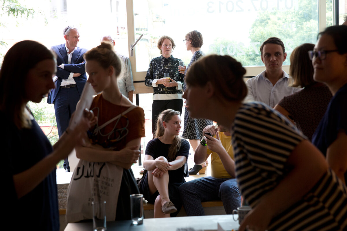 Many people gathered in the Munken Works Space looking at the art works